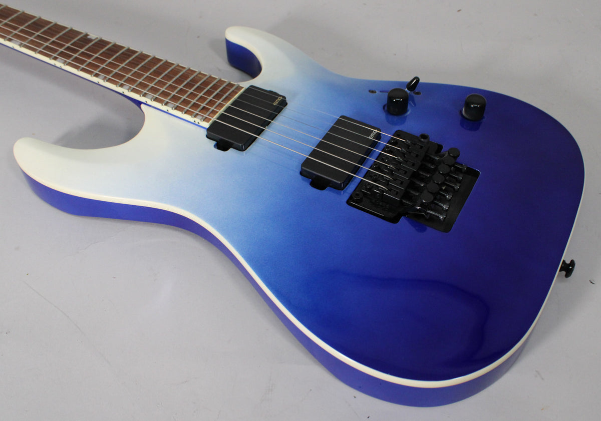 Electric guitar with a blue pearl fade metallic finish, black hardware, two humbuckers, and a Floyd Rose tremolo system.