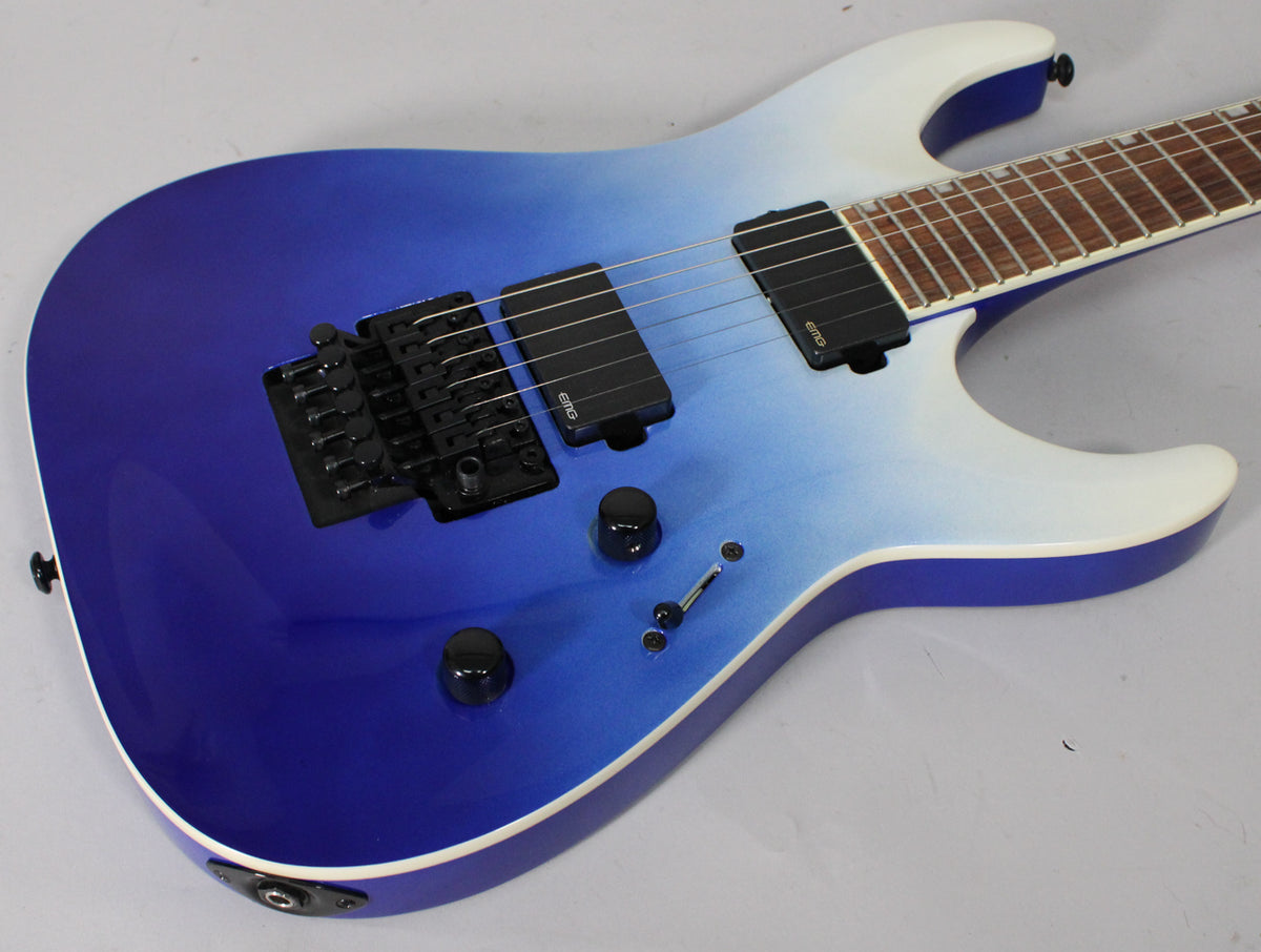 Electric guitar, blue pearl fade metallic finish, black Floyd Rose tremolo, two black humbucker pickups, and two black control knobs.