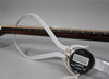 A digital caliper measures the dark brown fretboard and strings, showing a reading of 0.85.