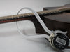 A digital caliper measures the dark brown neck at the 12th fret, showing a reading of 0.93.
