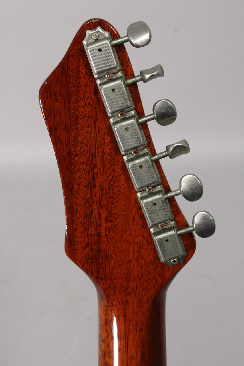 Close-up of the guitar's amber nitro headstock and neck, showing six aged, rectangular tuners with oval buttons and finish checking.