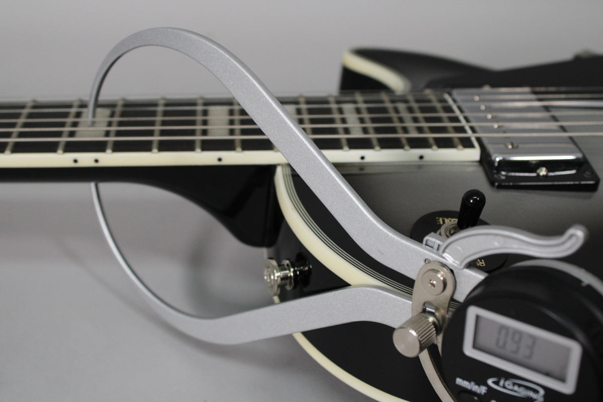 Close-up of the Silverburst Les Paul's neck and body, with a digital caliper measuring the fret height at 0.93mm.