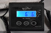 A black digital scale displays "6 LB 6 OZ" in blue, with a coiled black cable visible on the left.