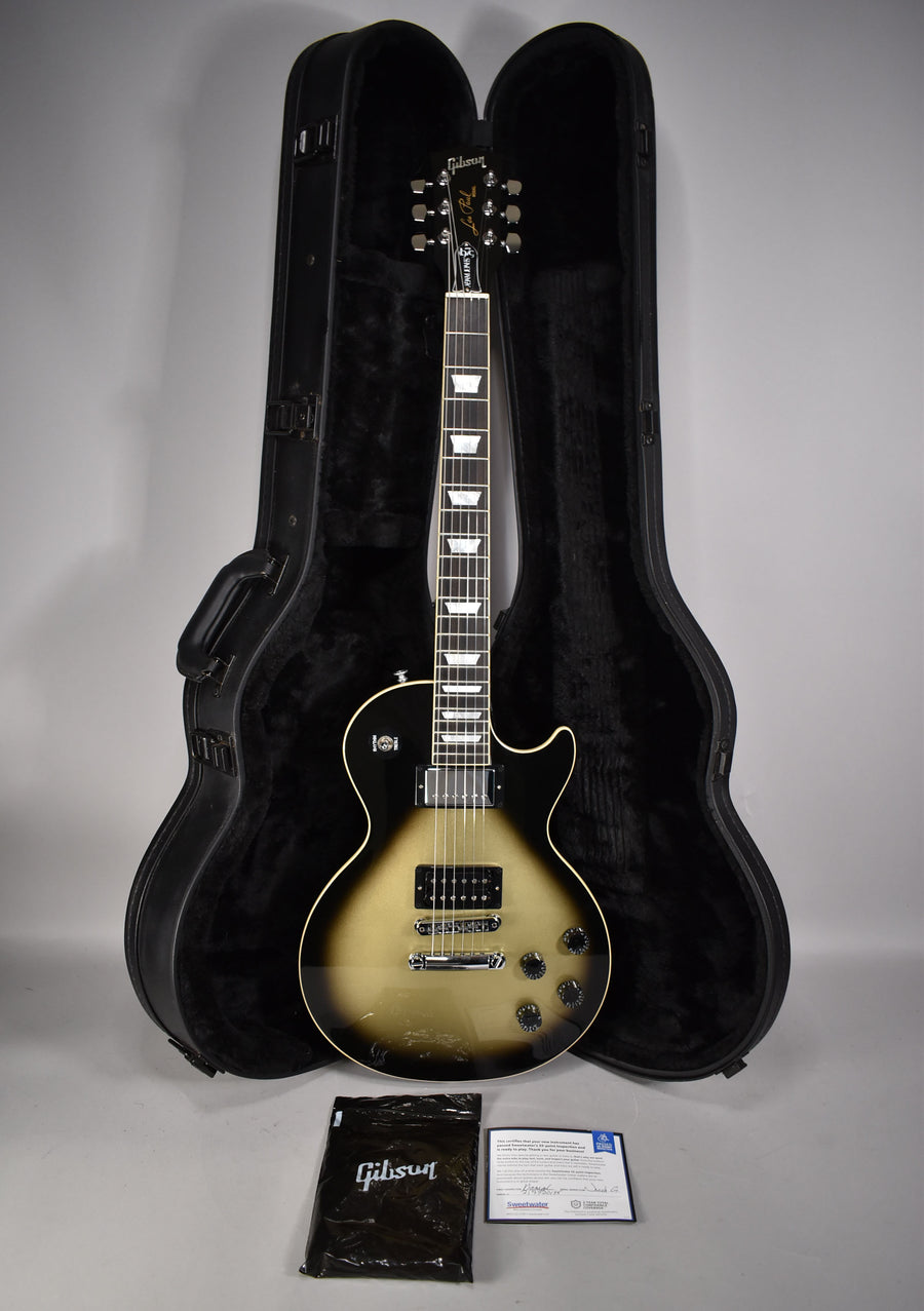 Full-length view of a Les Paul in Antique Silverburst finish, with black hardware, cream binding, and trapezoid inlays.