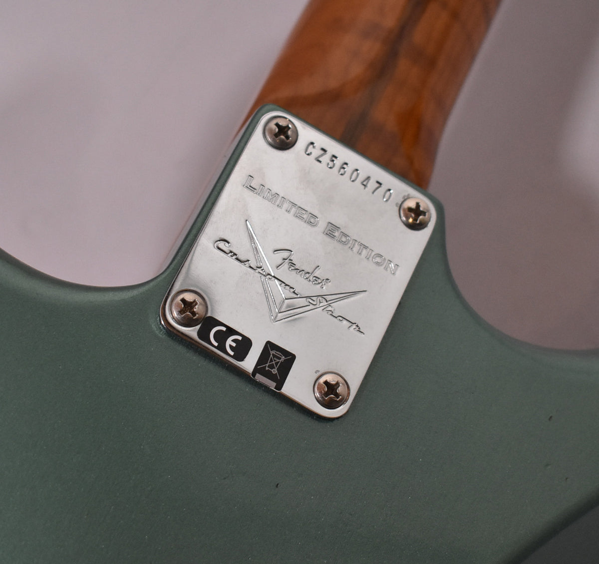 Close-up of the guitar's Sherwood Metallic body and neck plate, showing "LIMITED EDITION" and a serial number, with light relic wear.