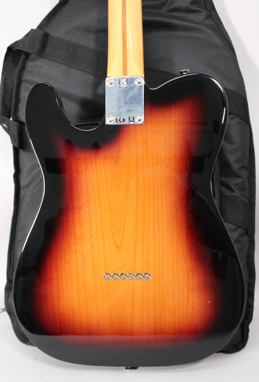 The back of a 2-Color Sunburst guitar, showing the maple neck, chrome neck plate, and six string ferrules on the body.