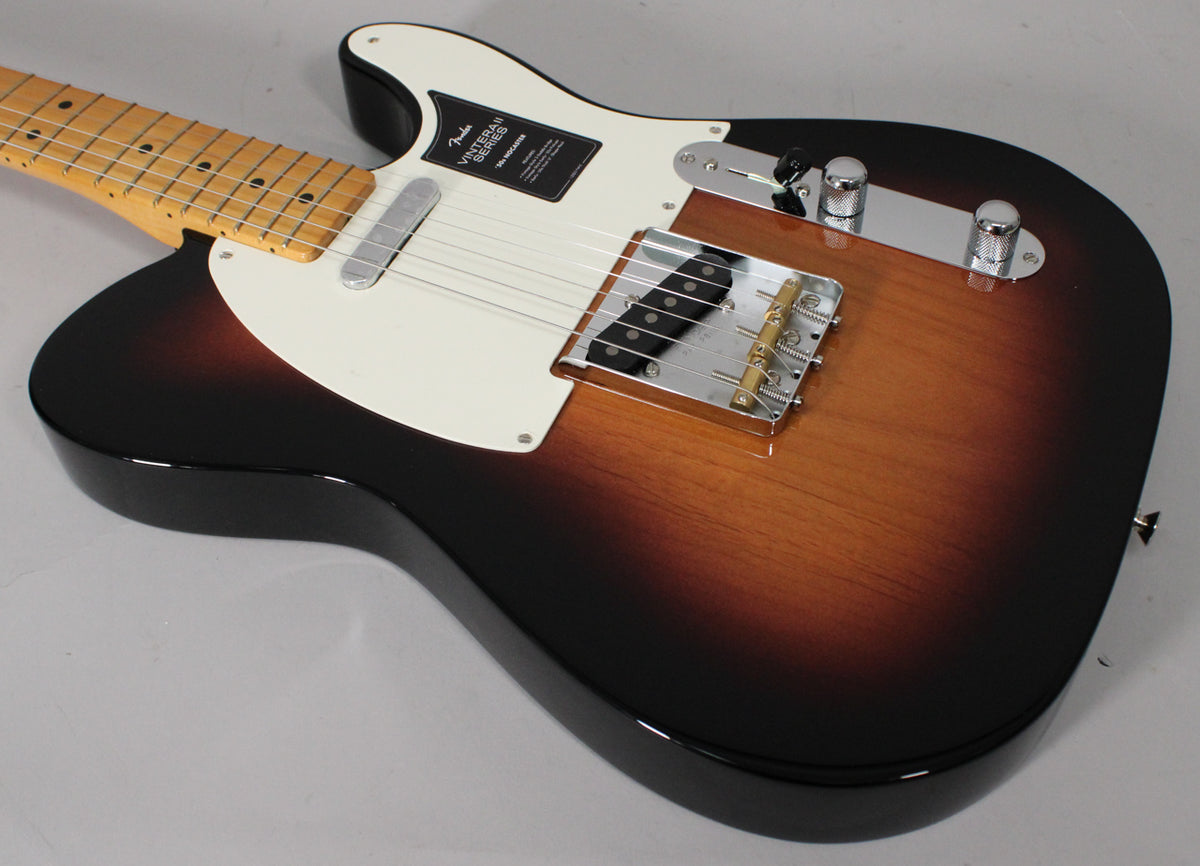 The 2-Color Sunburst Nocaster is angled from the upper left, showing its glossy finish, white pickguard, and chrome hardware.