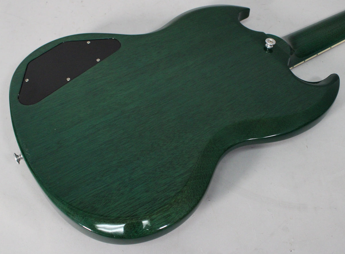 The back of a translucent teal SG Standard, angled from the lower bout, showing the grain, control cavity cover, and strap buttons.