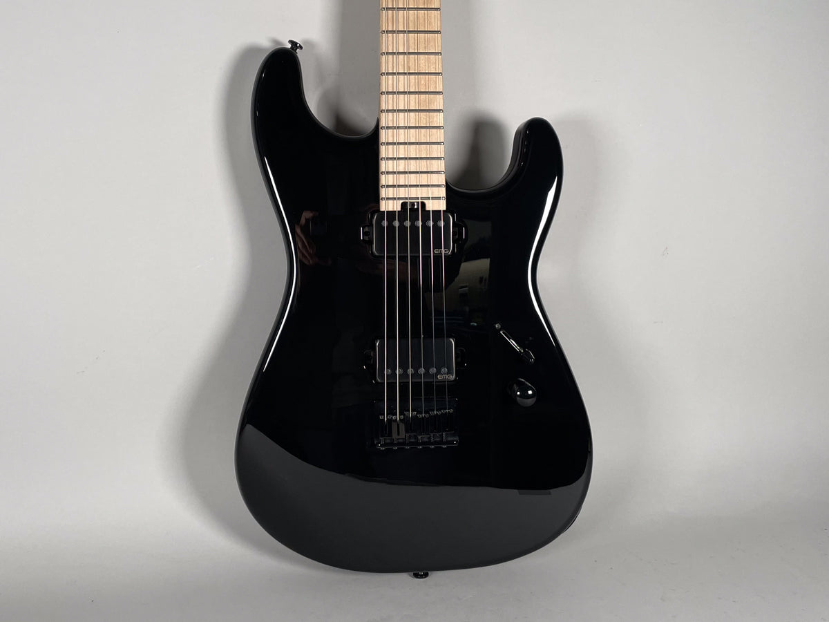 Full front view of a glossy black electric guitar with a light maple fretboard, black hardware, and two humbucker pickups.