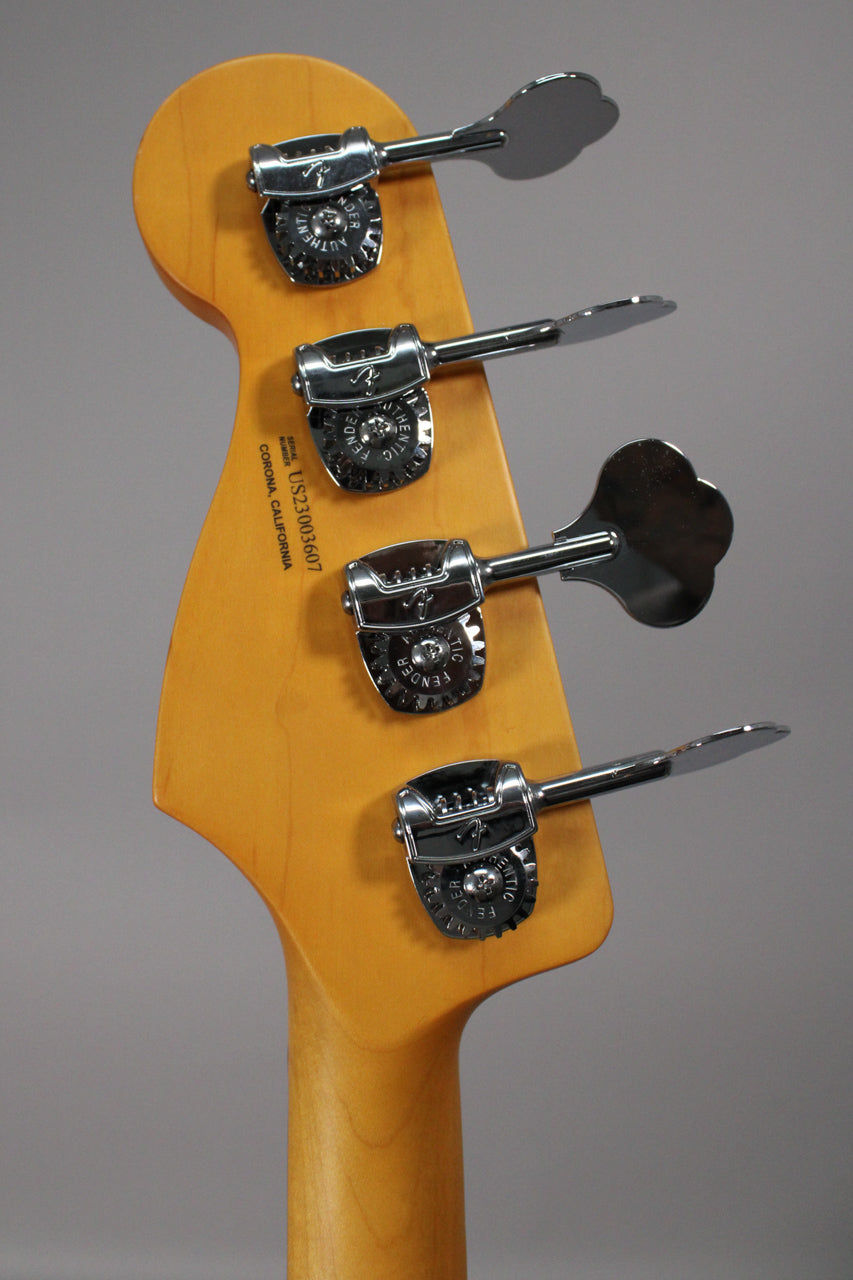 The back of a light-colored maple headstock with four chrome tuning machines, angled slightly from the left.