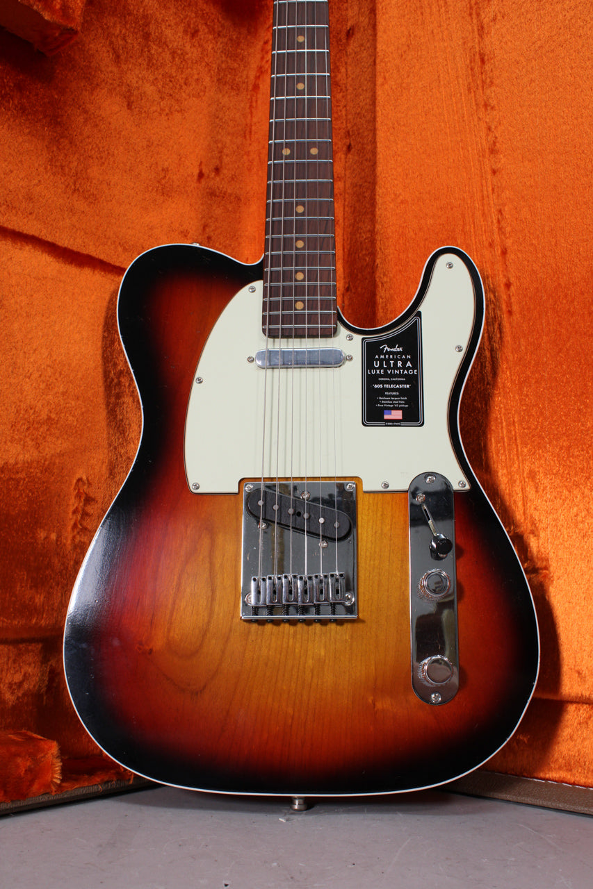 Full front view of a 3-color sunburst Telecaster, showing a rosewood fretboard, cream pickguard, and chrome hardware.