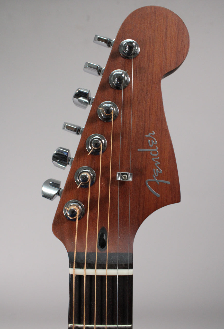 Close-up of the guitar's dark brown headstock with a satin finish, showing six chrome tuners and the top of the fretboard.