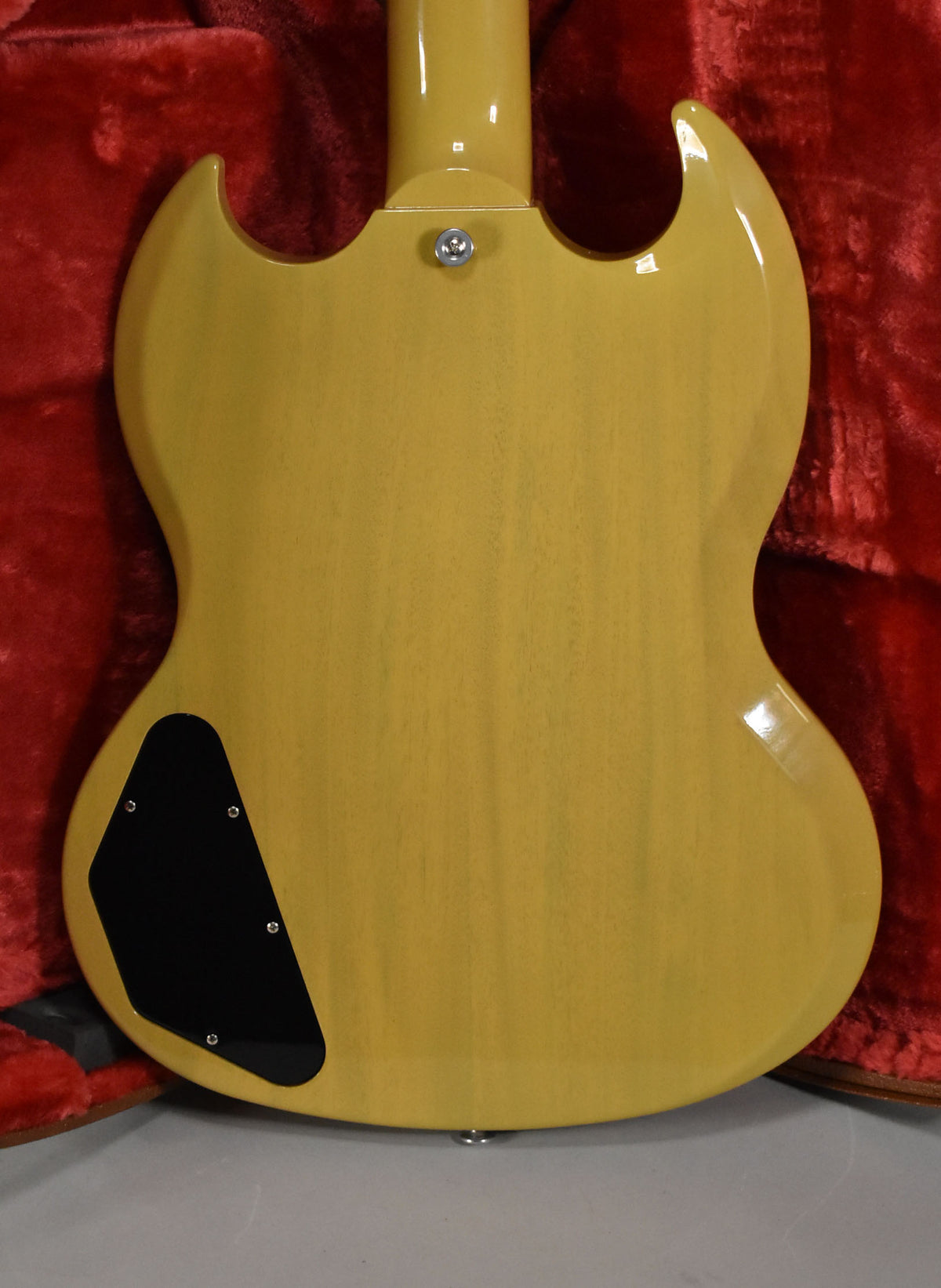 The back of a TV Yellow SG, showing the neck joint, upper strap button, and control cavity cover.