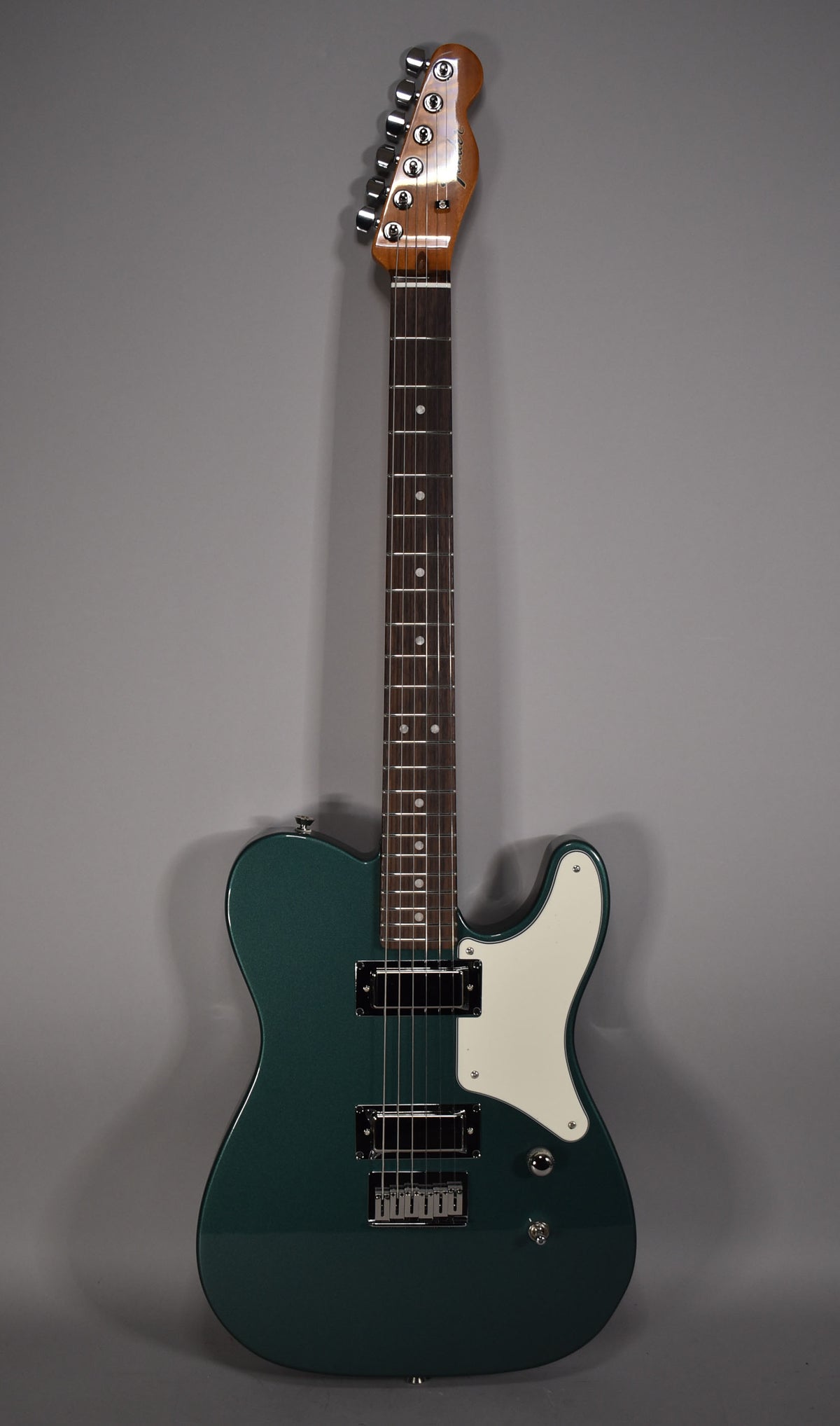 Full-length view of a Sherwood Green Telecaster with a white pickguard, two humbuckers, and a chrome hardtail bridge.
