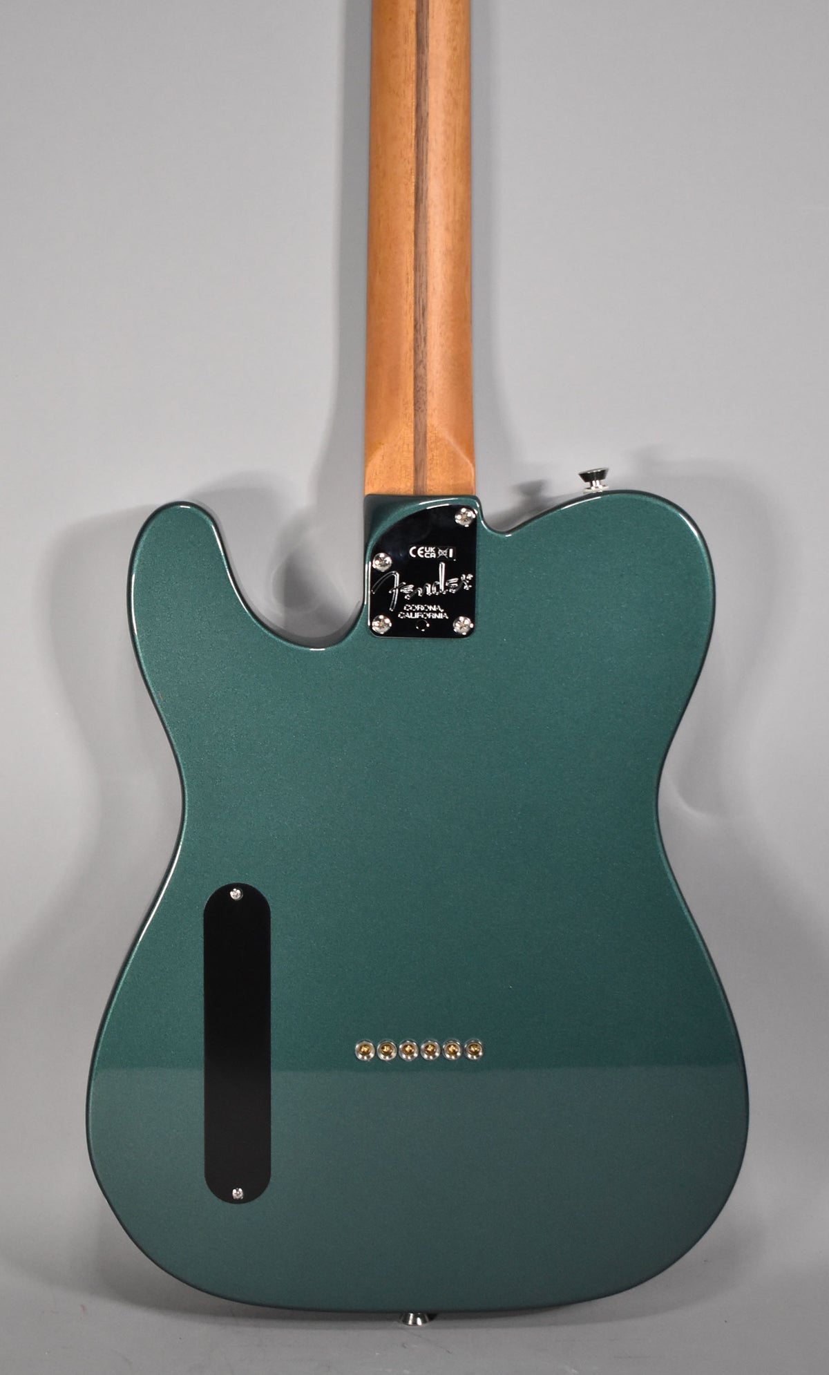 Full rear view of a Sherwood Green Telecaster with a maple neck, string-through-body ferrules, and a black neck plate.