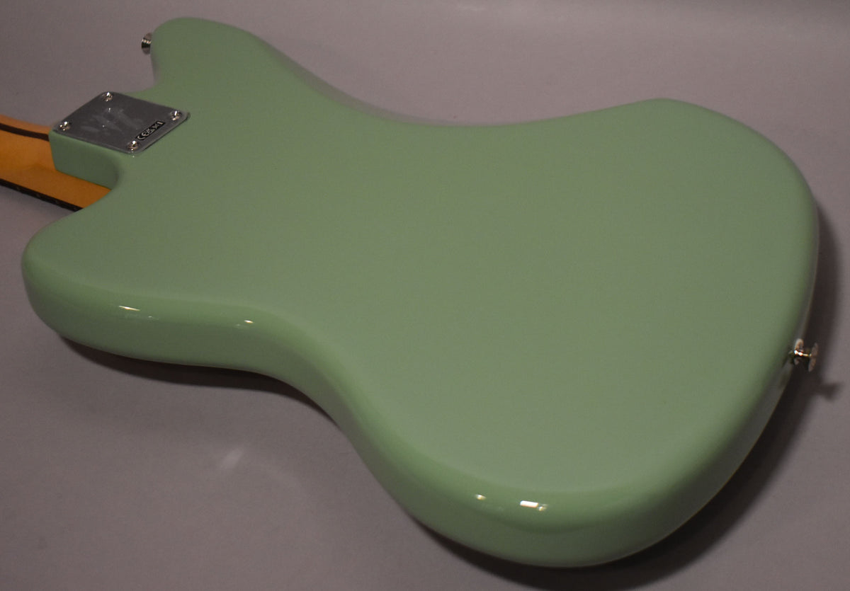 The back of the Birch Green Jazzmaster body, showing its glossy finish, chrome neck plate, and strap button.
