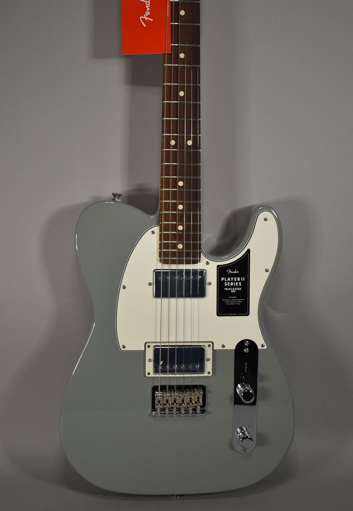 Full-front view of a new Cactus Gray Telecaster with a white pickguard, two humbuckers, and chrome hardware.