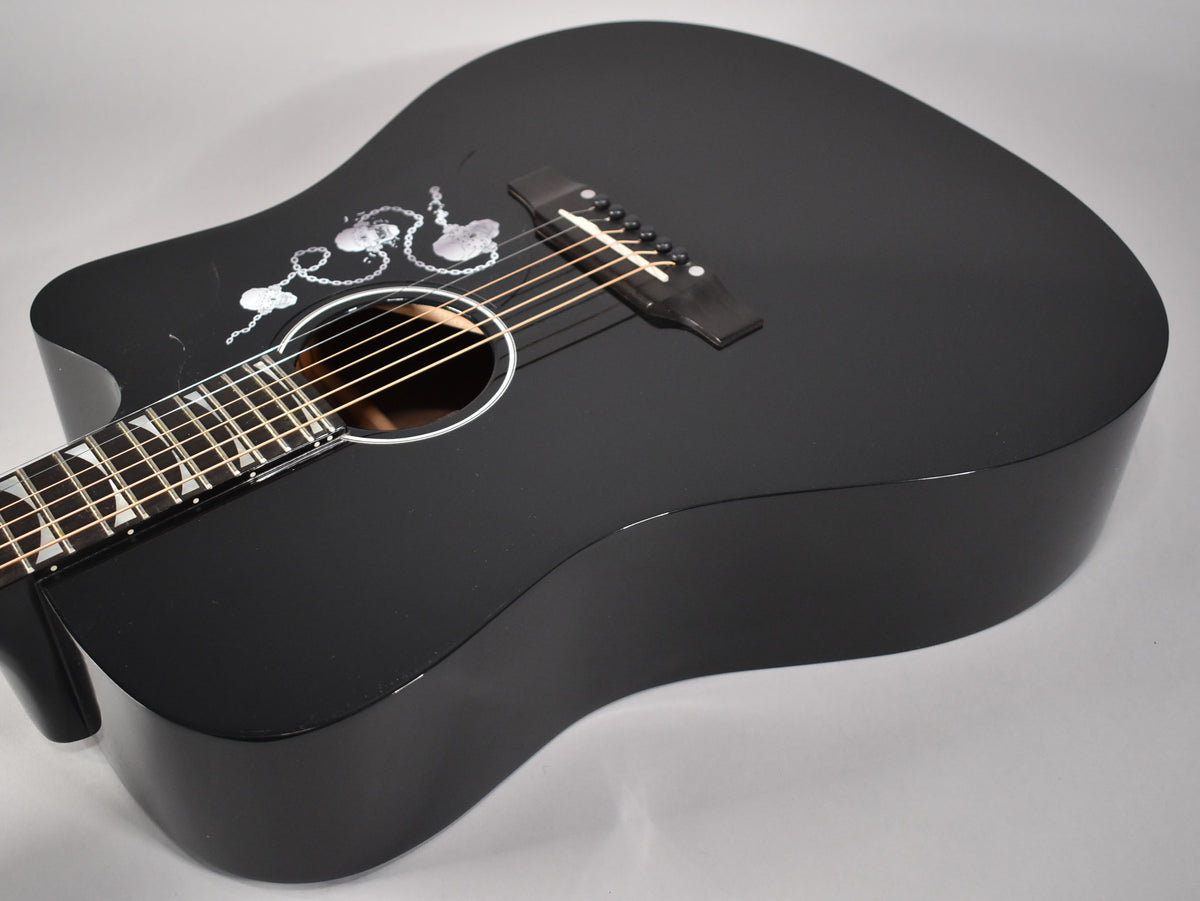 Acoustic-electric guitar, ebony finish, with a cutaway and white chain-link graphic on the upper bout.