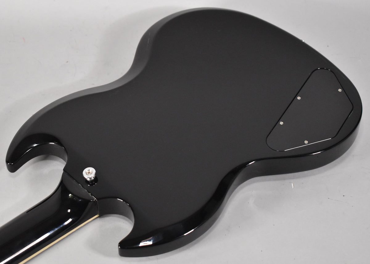 The back of an ebony SG Special, showing the control cavity cover and the neck joint with a strap button.
