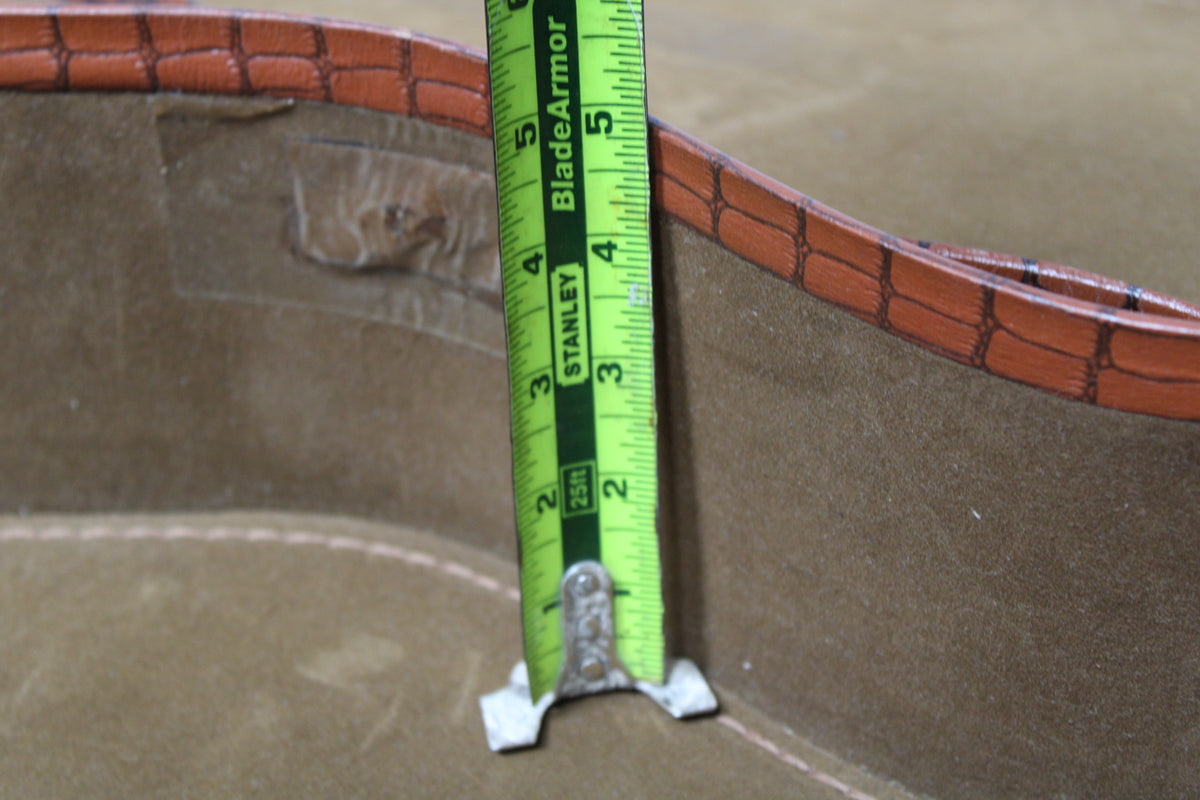 A close-up of the brown snakeskin soft case's interior, showing a tape measure indicating a depth of approximately 4.5 inches.