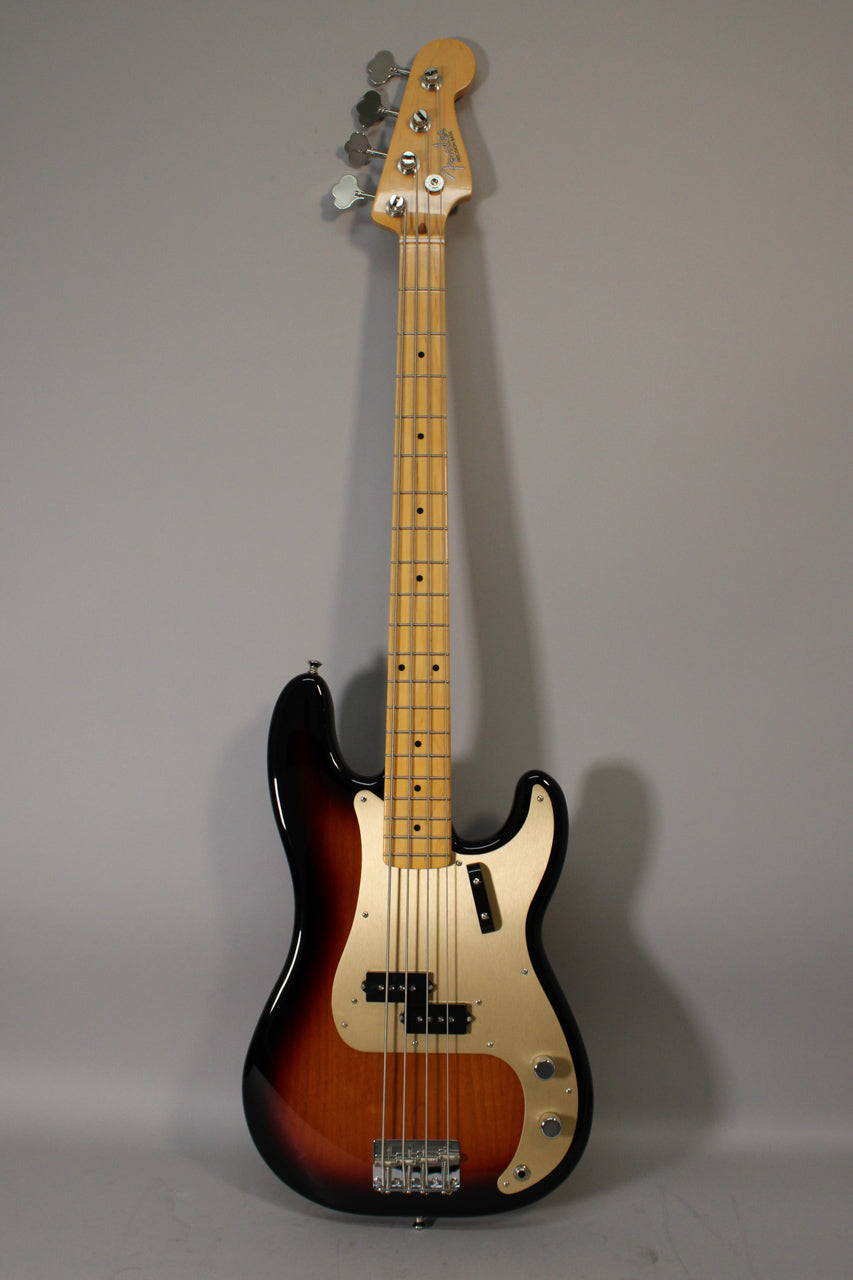 Full-length view of a sunburst P-style bass with a maple neck, gold anodized pickguard, split-coil pickup, and two control knobs.