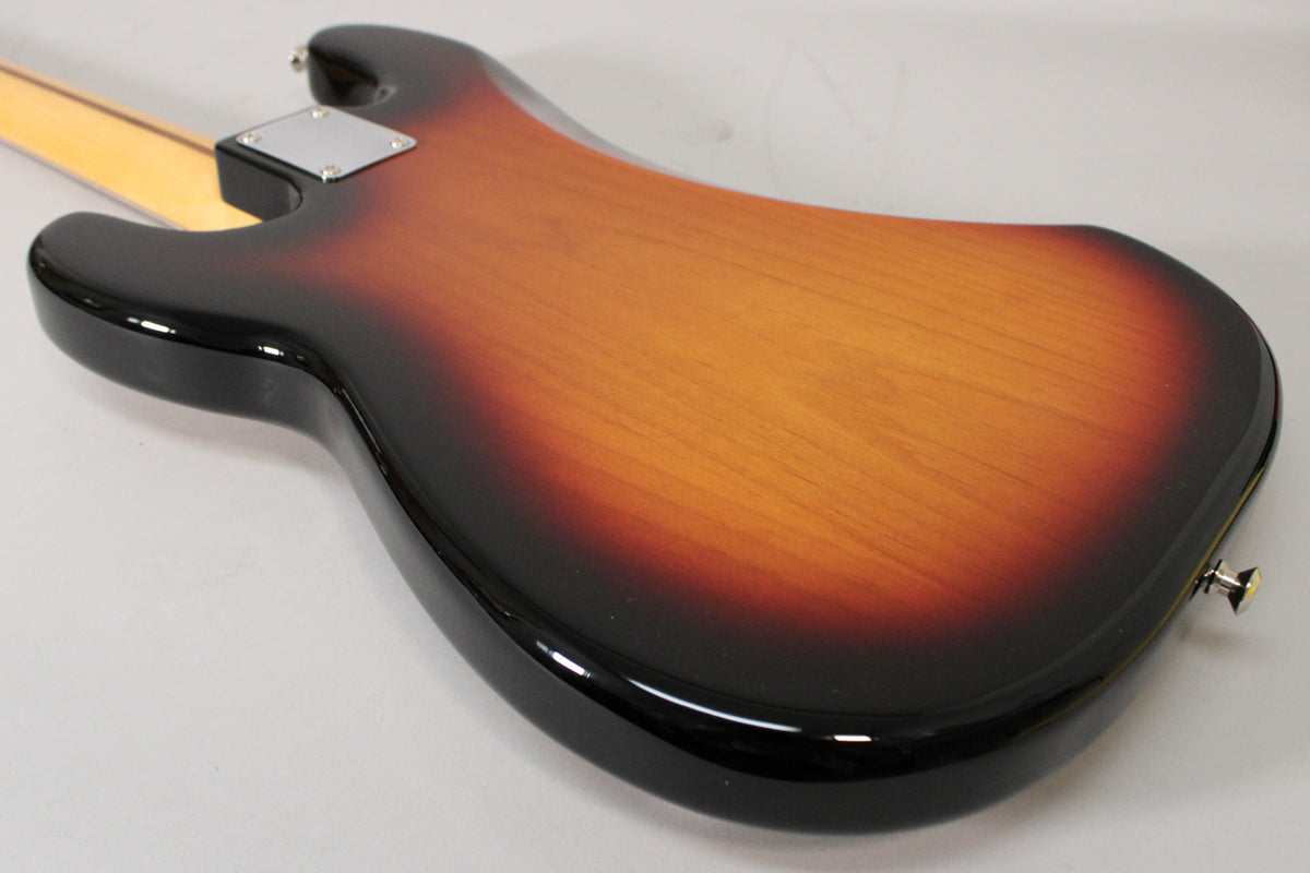 Rear view of a sunburst P-style bass body, showing the neck plate, strap button, and glossy finish with minor surface wear.