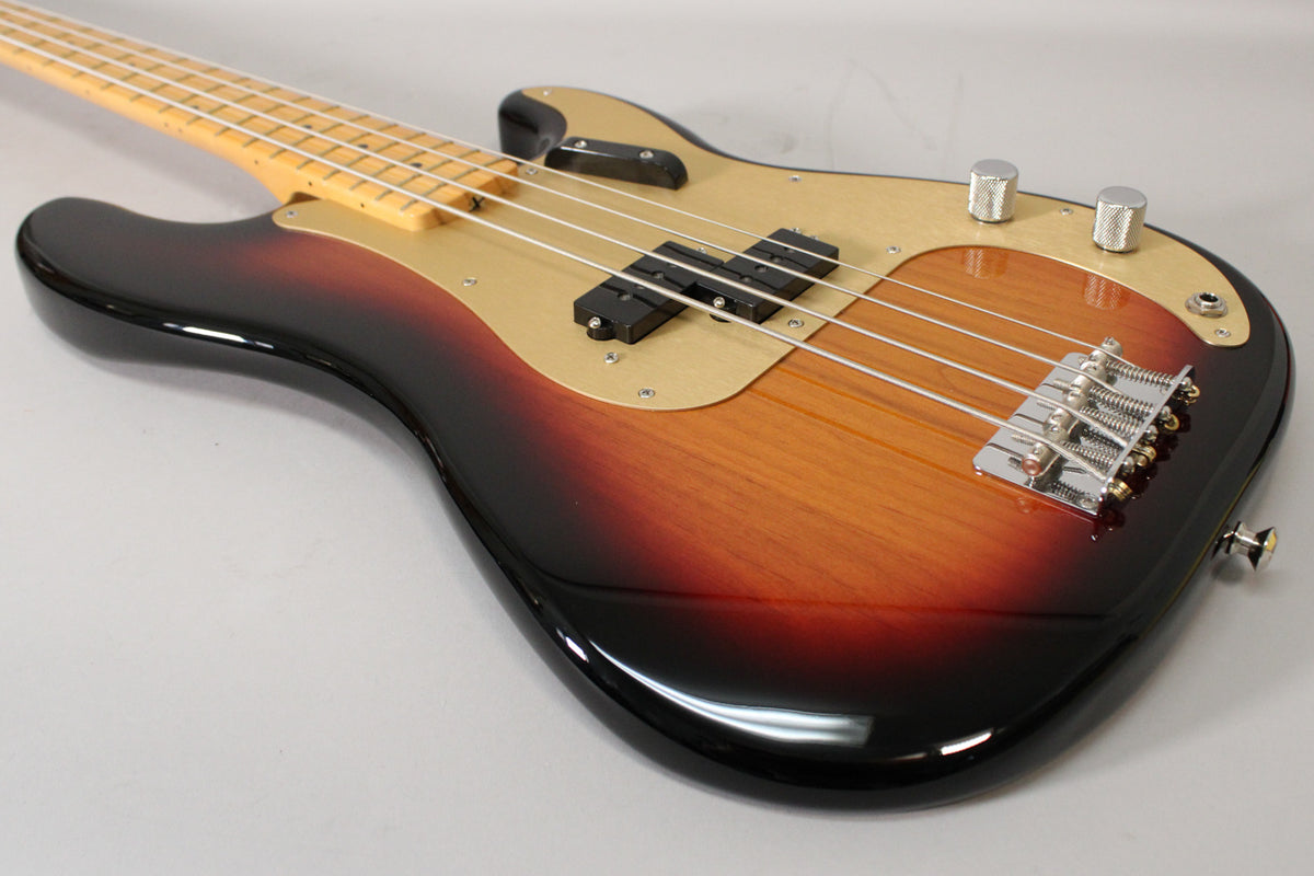 The sunburst bass body, with a gold pickguard, split pickup, chrome bridge, and two knurled control knobs.