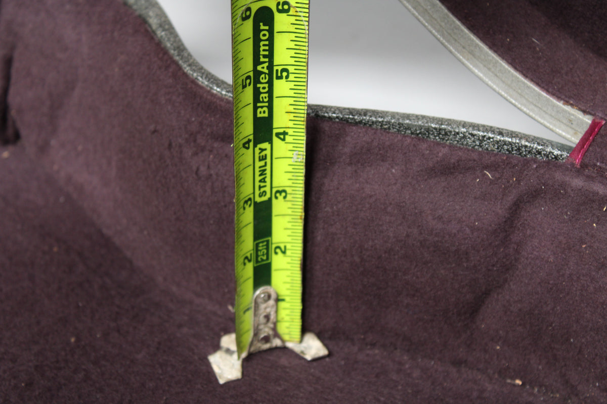 A close-up of the case's dark purple plush interior, with a tape measure showing a depth of 2.5 inches.