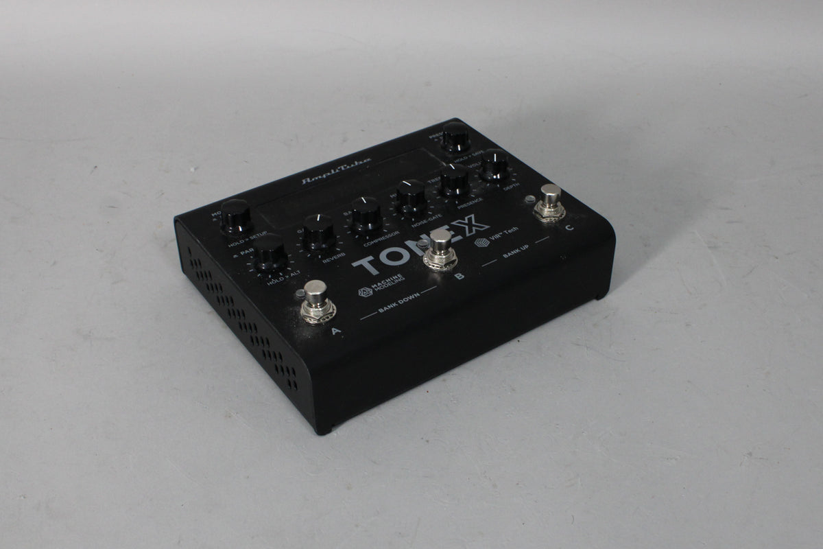 Black multi-effects pedal with 9 black knobs, 3 silver footswitches, and a vented left side, viewed from the front-right.