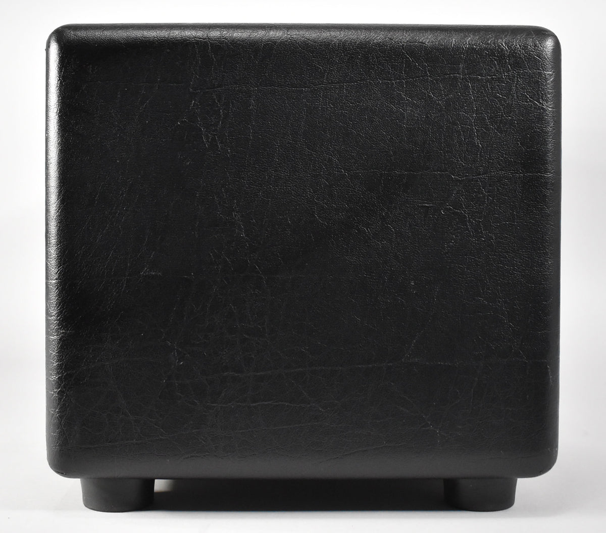 Rear view of the black tolex amplifier head, showing its textured finish, rounded corners, and two visible rubber feet.