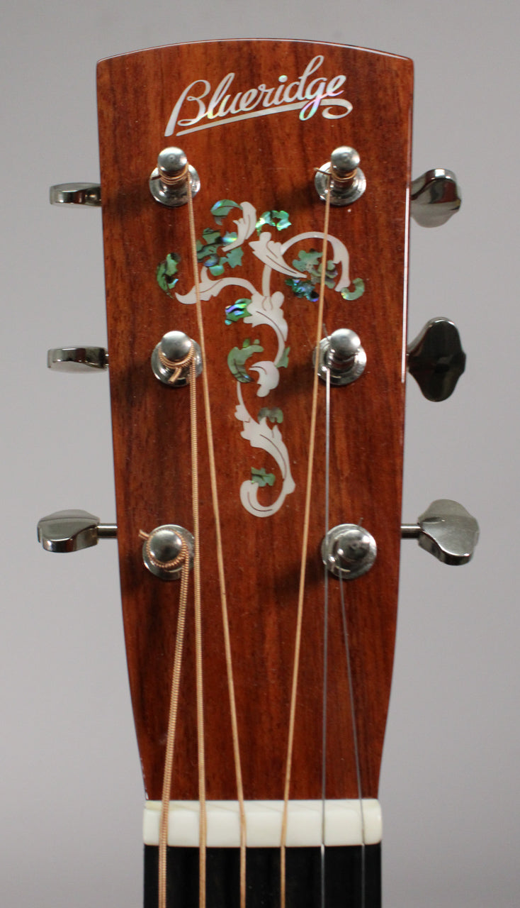 Close-up of the mahogany headstock, showing the mother-of-pearl "Blueridge" script and ornate floral inlay, with six chrome tuners.
