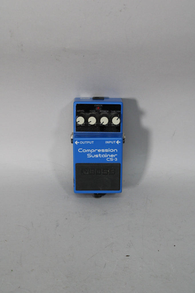 A blue effect pedal with a black footpad, four white control knobs, and a red indicator light, viewed from above.