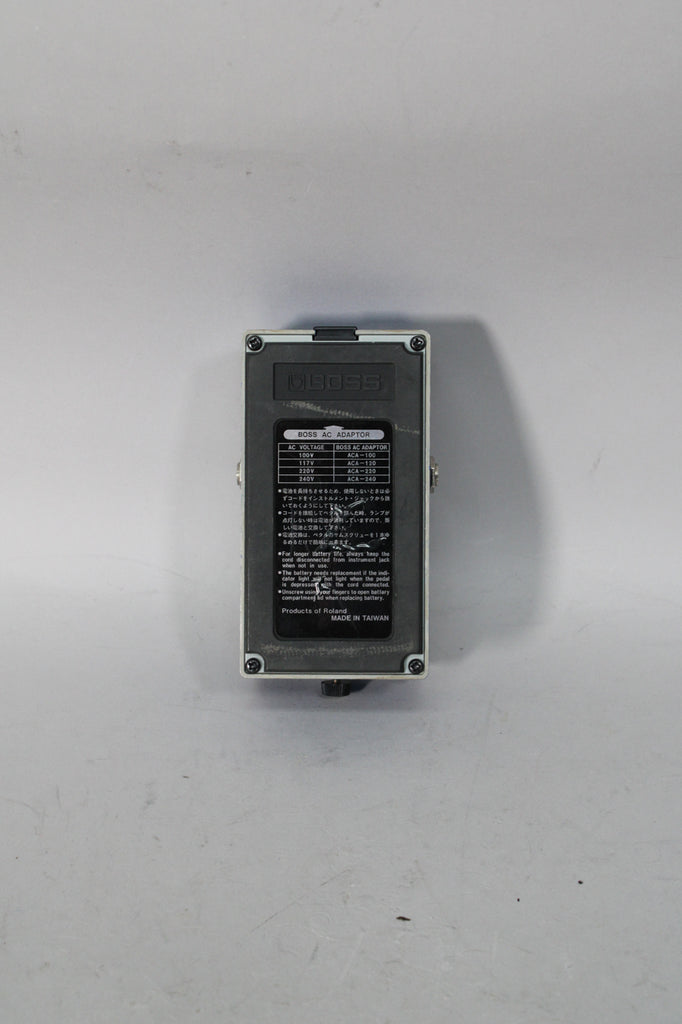 The pedal's gray base is seen from above, with a black rectangular label showing text and a "Made in Taiwan" stamp.