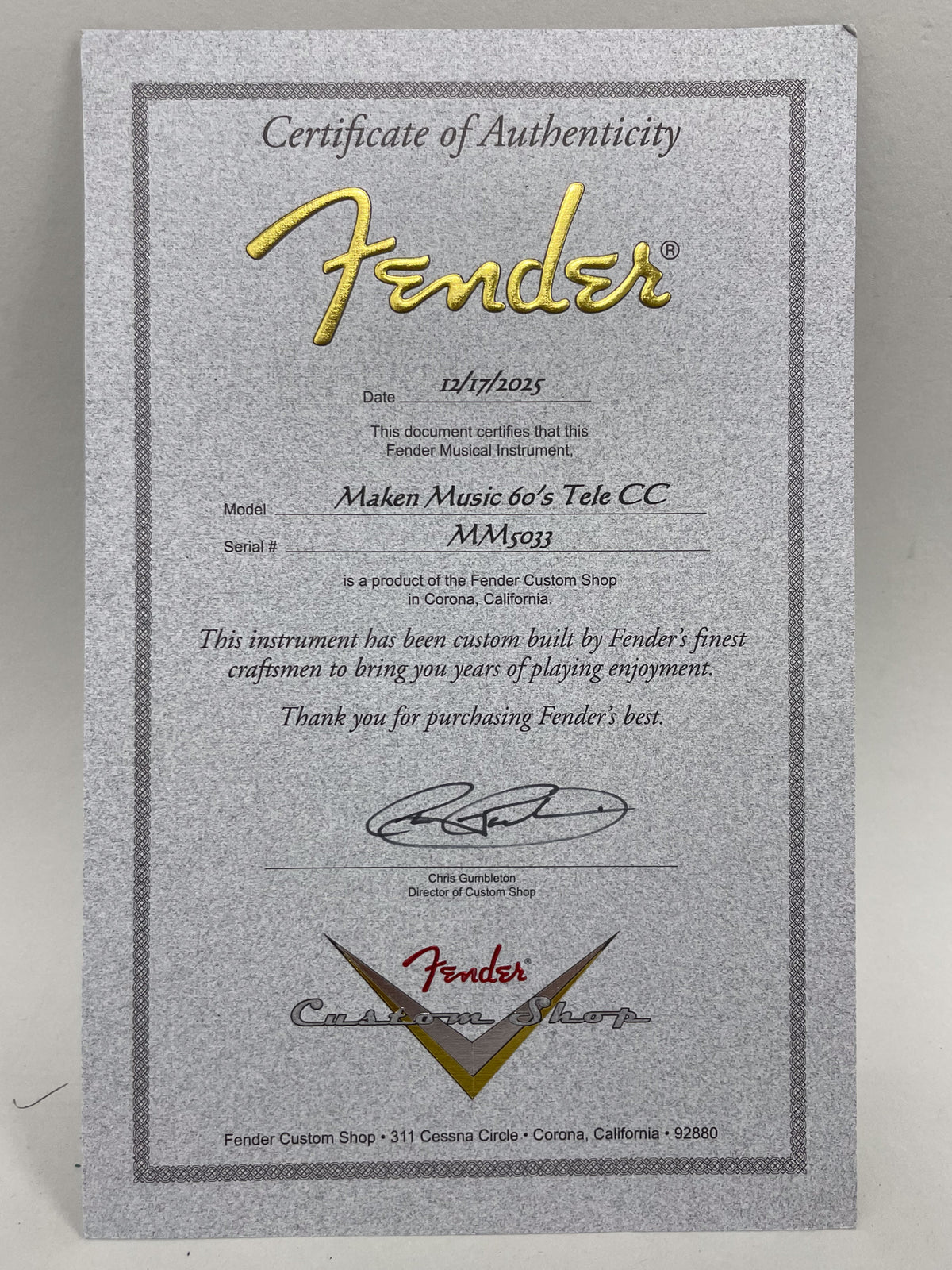 Full view of a gray "Certificate of Authenticity" with gold embossed text, dated 12/17/2025, for a "Maken Music 60's Tele CC".