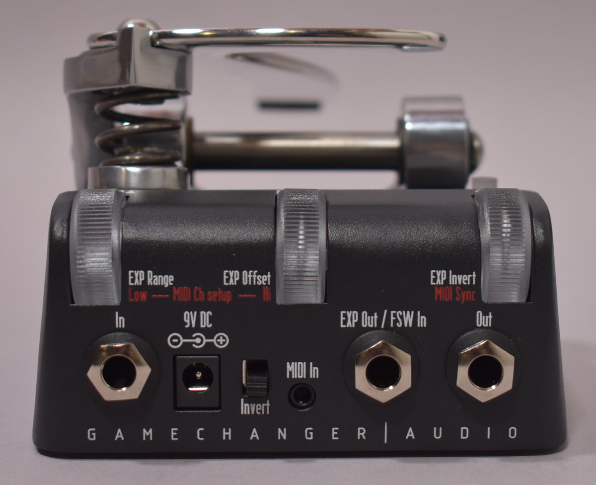 The pedal's rear panel is visible, showing three clear rotary controls, four 1/4" jacks, a power input, and a MIDI input.