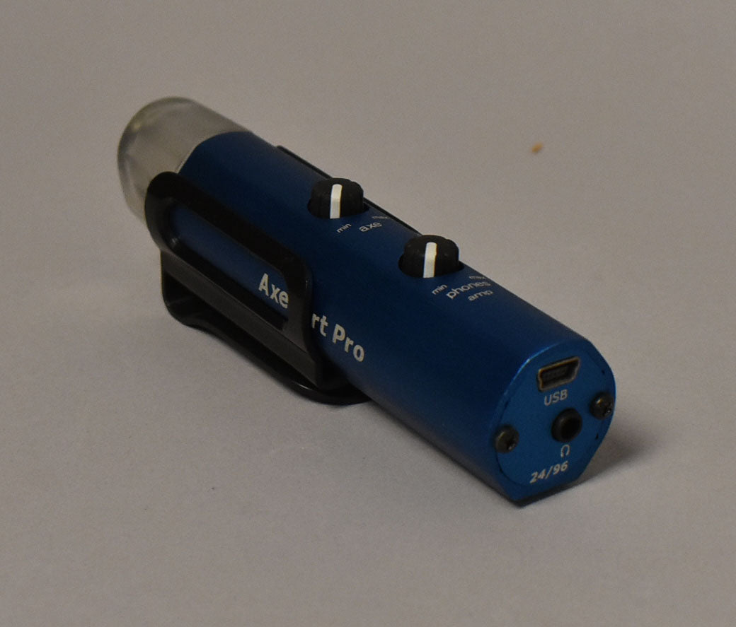 Blue cylindrical interface with a clear cap, black clip, two black knobs, a micro-USB port, and a headphone jack.