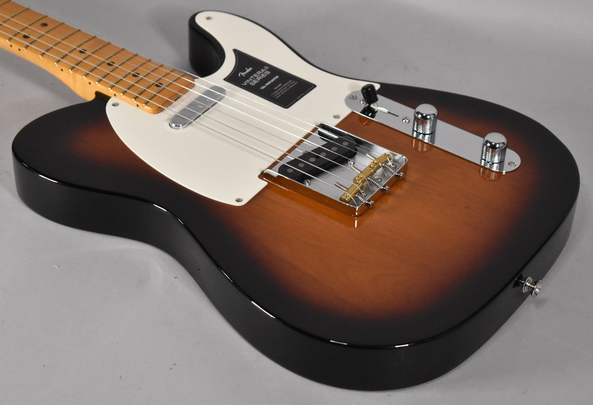 The Nocaster's body, in 2-Color Sunburst, is angled from the upper left, showing a cream pickguard and chrome hardware.