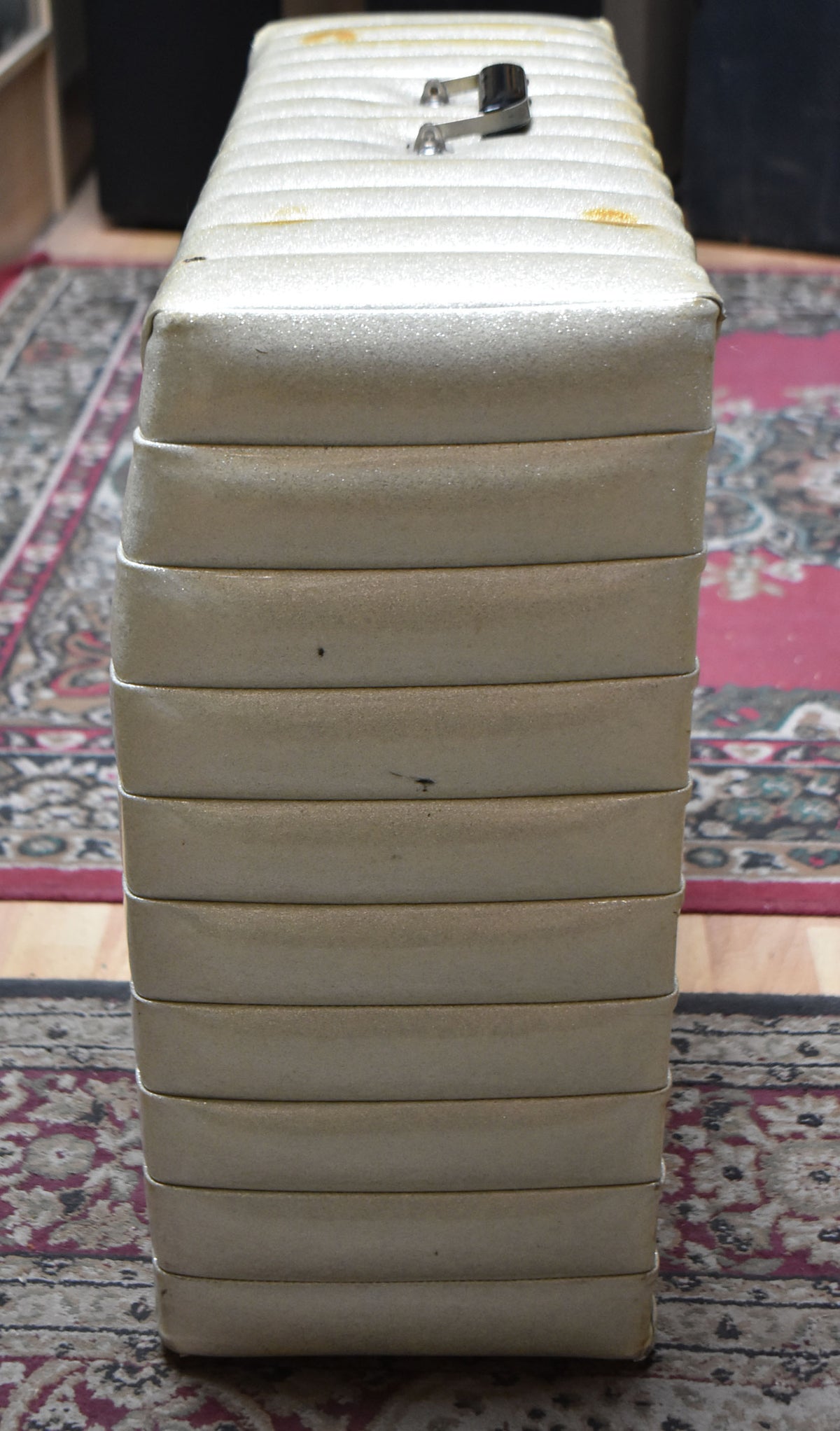 The amplifier's right side, covered in horizontal tuck-and-roll sparkle vinyl, shows some minor scuffs and yellowing on the top edge.