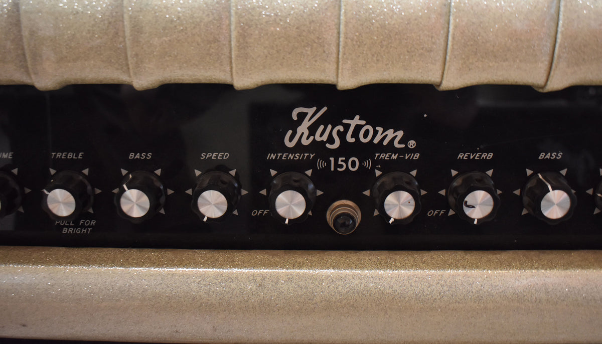 Close-up of a Kustom K-150-8 amplifier's control panel with "Tuck & Roll Sparkle" upholstery above.