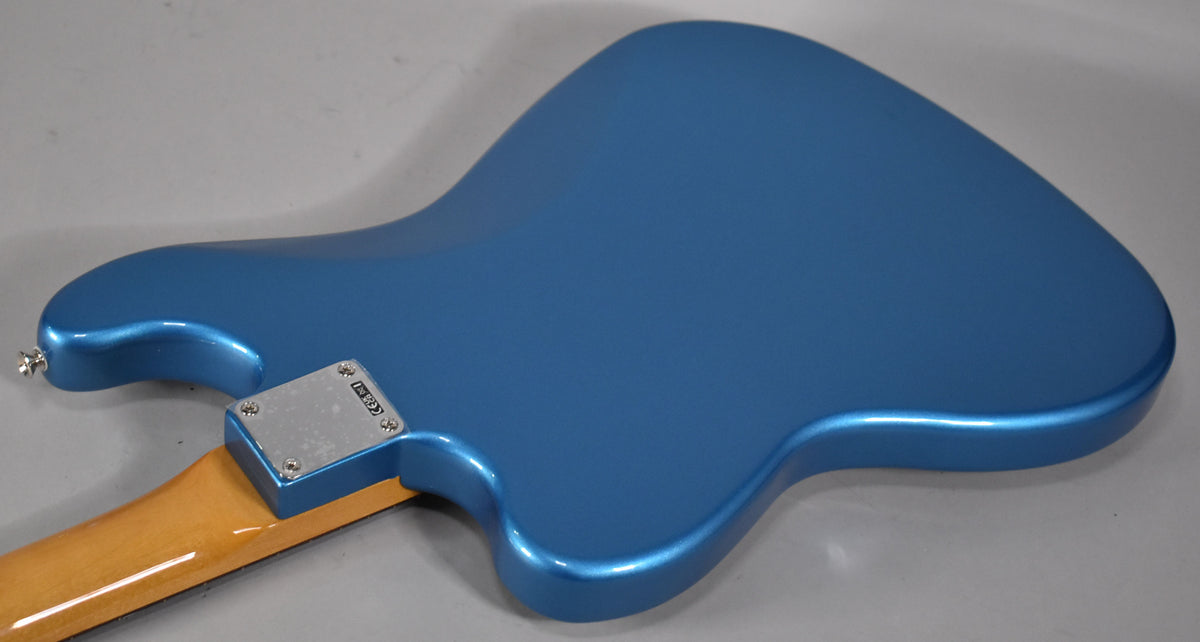 The back of a Lake Placid Blue Bass VI, showing the metallic finish, neck plate, and a portion of the maple neck.