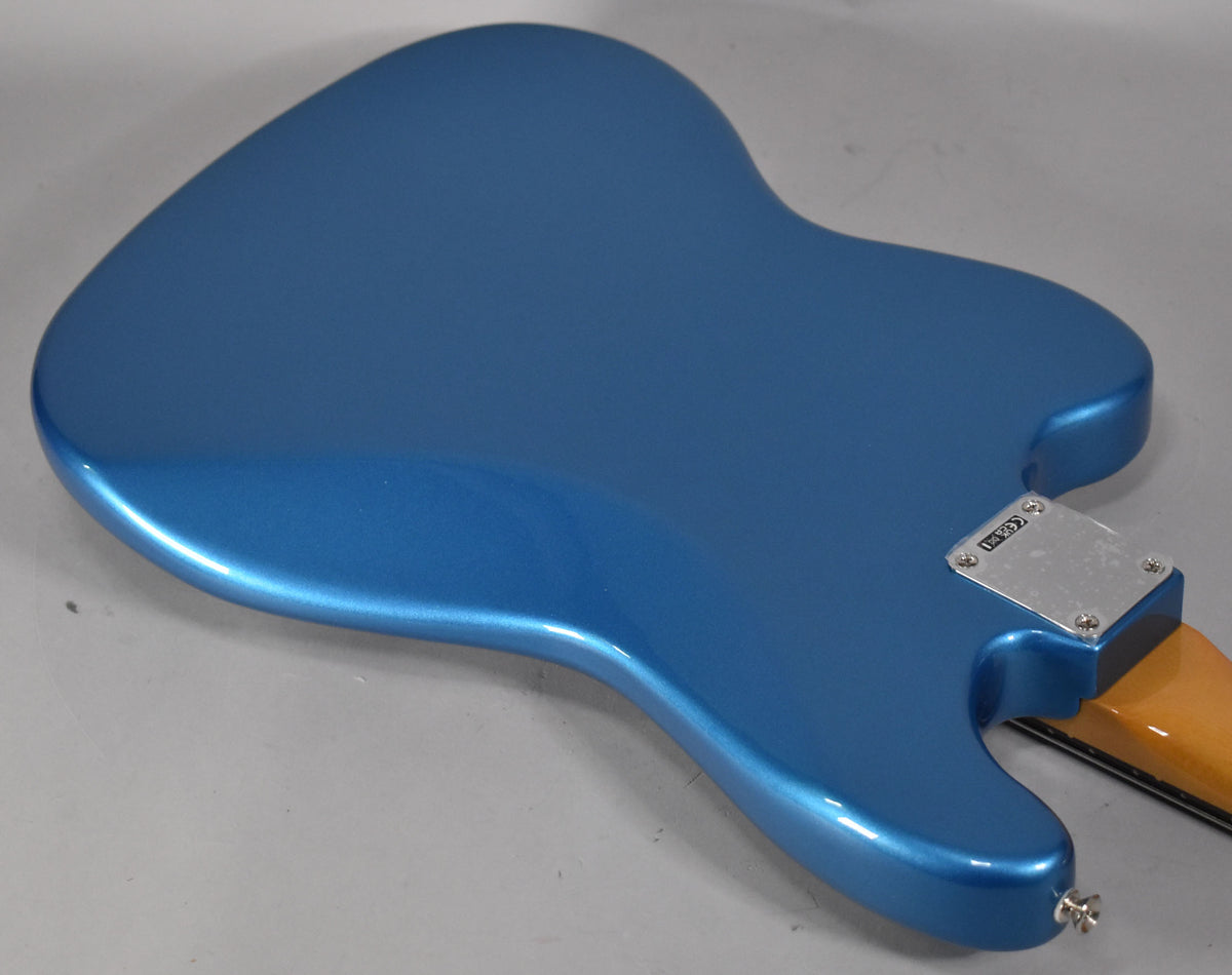 Back of a Lake Placid Blue Bass VI, showing the metallic finish, chrome neck plate, and a strap button at the lower horn.