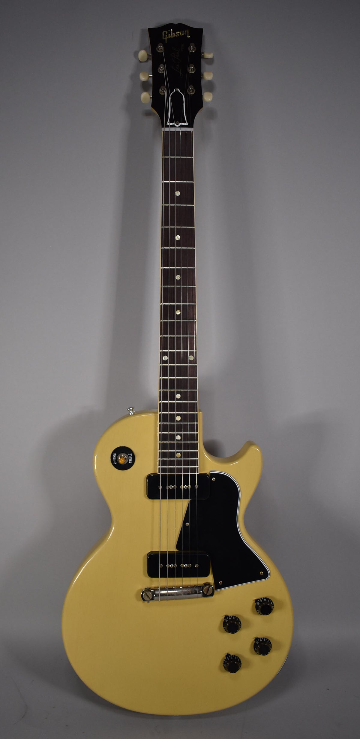 Full front view of a TV yellow single-cut guitar with a black pickguard, two P90 pickups, and four black control knobs.