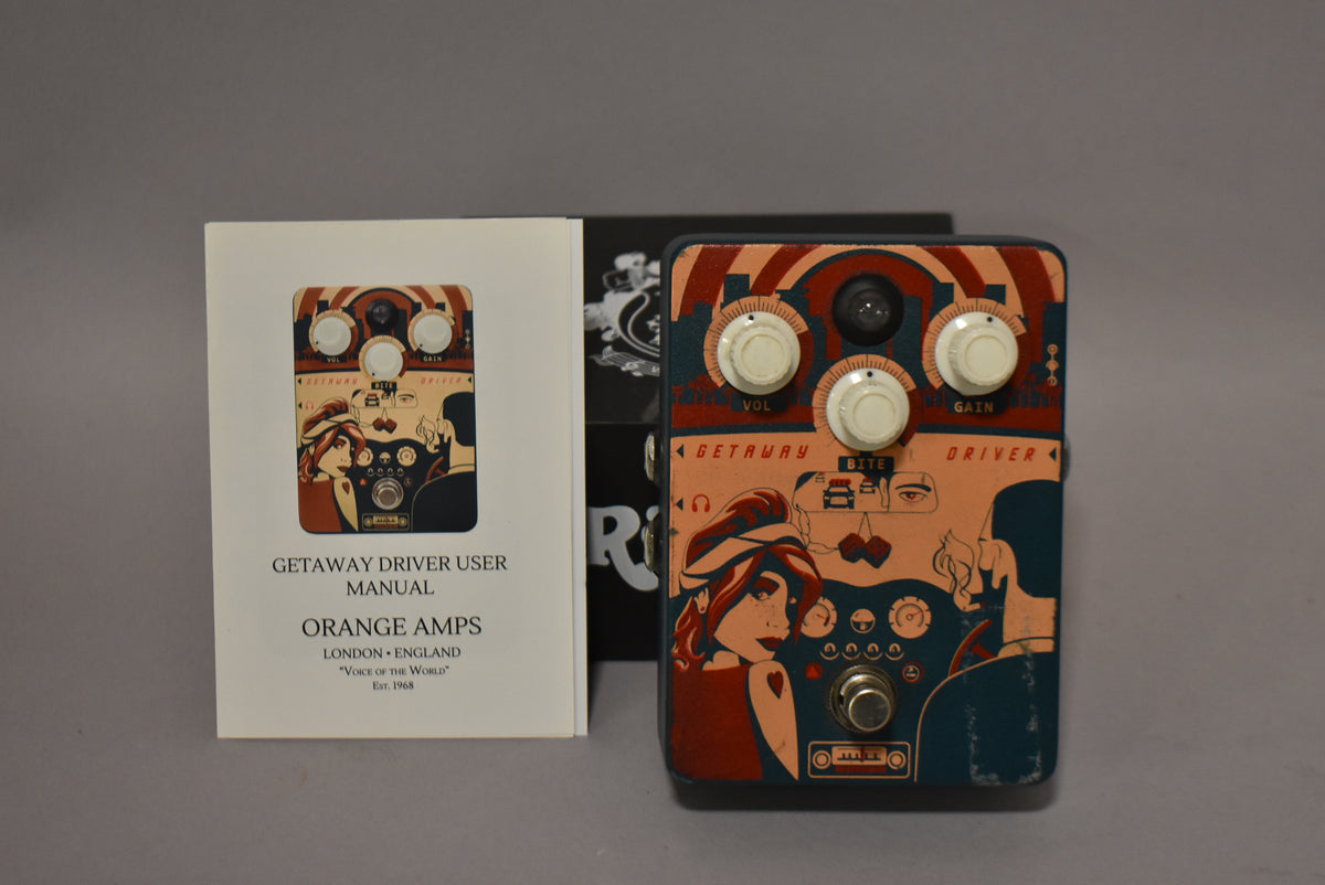 A top-down view of a rectangular guitar pedal with a retro-style graphic, four cream knobs, and a footswitch.