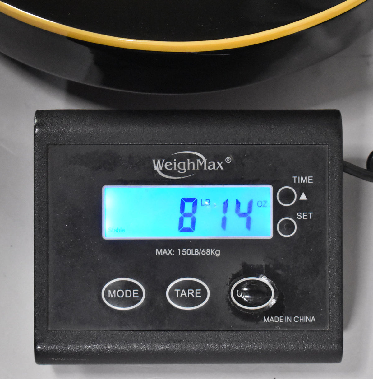A WeighMax scale displays "8 L3 14 oz" with "stable" and "MAX: 150LB/68Kg" visible.