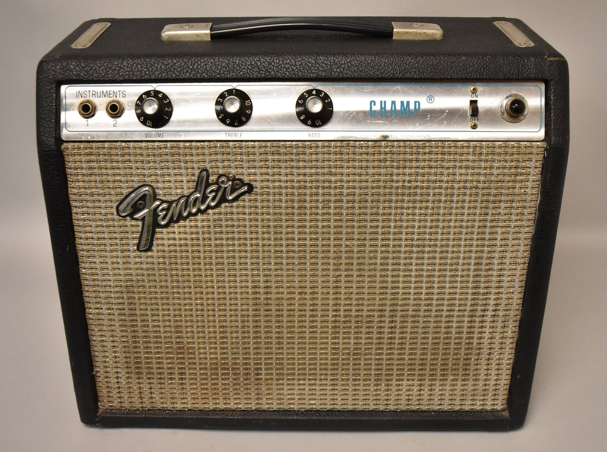 Front view of a black tolex amp with a silverface control panel, tan grille cloth, and a black handle.
