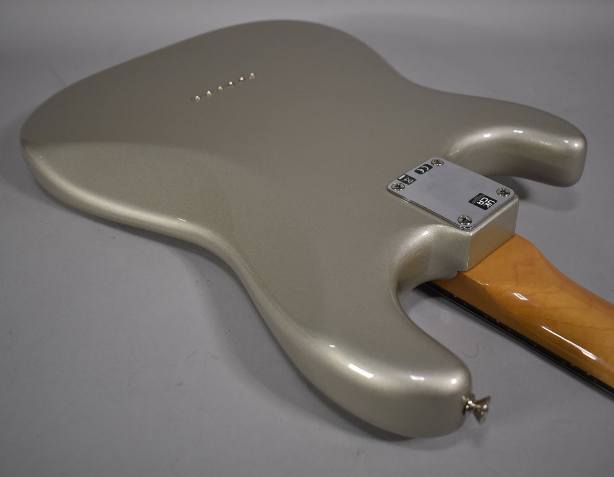 The back of the Inca Silver Stratocaster body is shown at an angle, revealing the neck plate and six string-through-body ferrules.