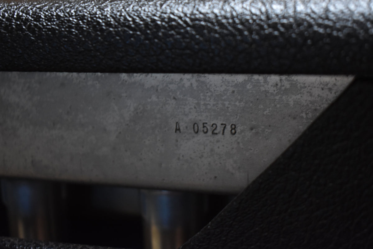Close-up of the amp's metal chassis, showing serial number A 05278 and visible wear, framed by black textured tolex.