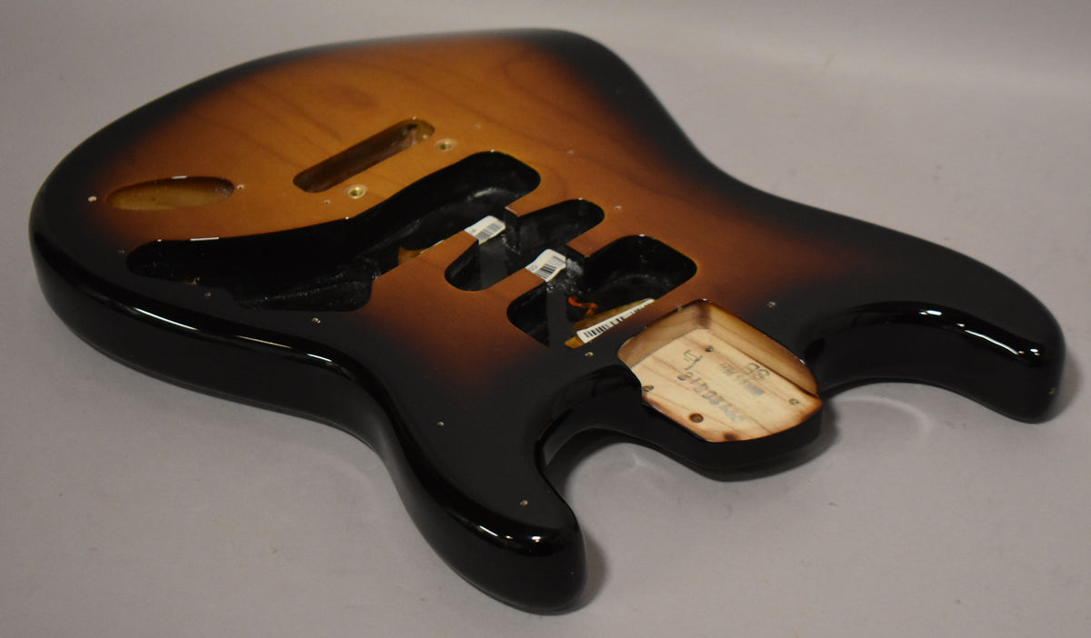 This 2-tone sunburst Stratocaster body, viewed from above, shows the glossy finish, three pickup routes, and the neck pocket.