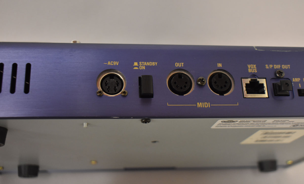 The blue pedal's rear panel shows MIDI In/Out, AC9V, Standby switch, Vox Bus, and S/P DIF Out ports.