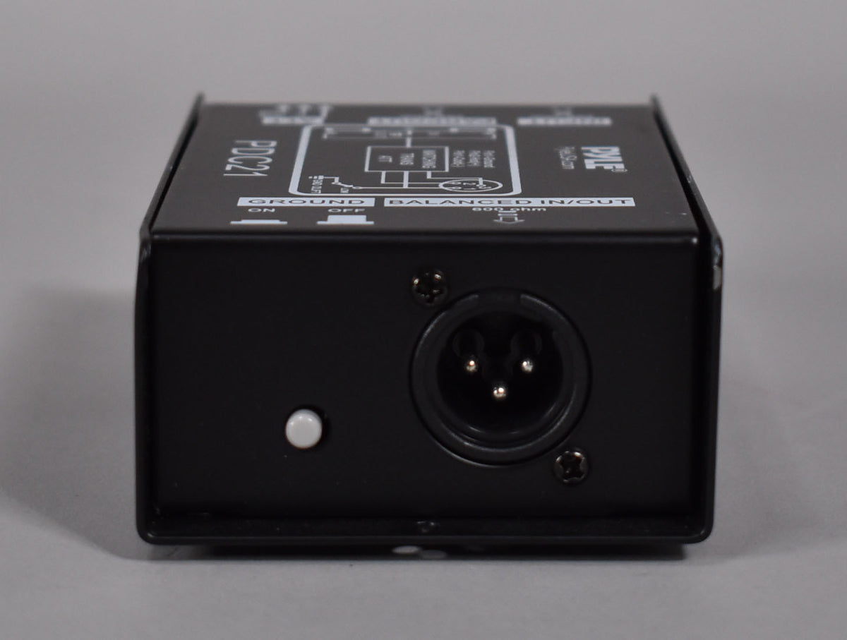 The black direct box is viewed from the front, showing a white ground lift button and a three-pin XLR input.